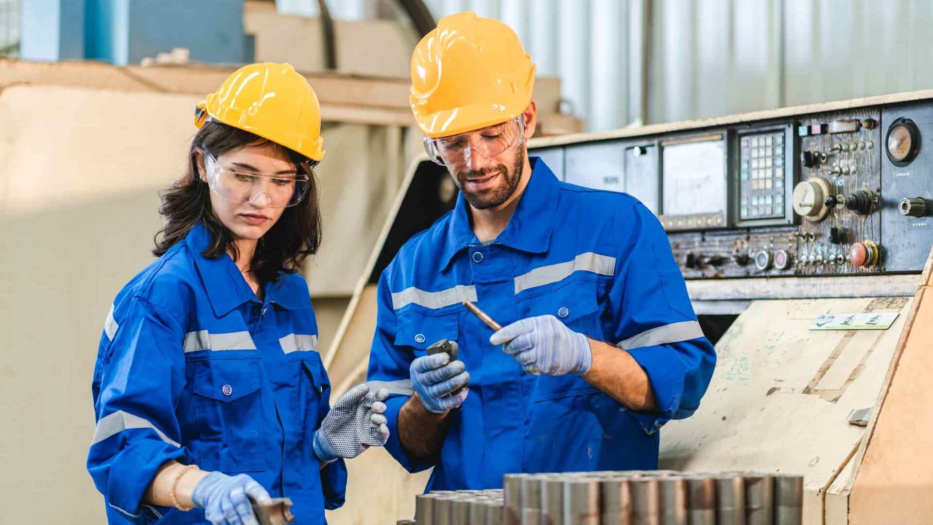 Engineers analyzing machinery bearing failure