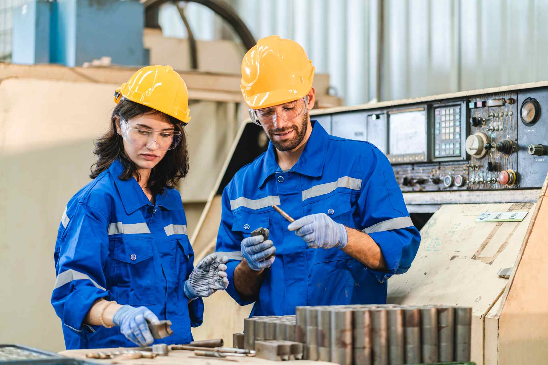 Engineers analyzing machinery bearing failure