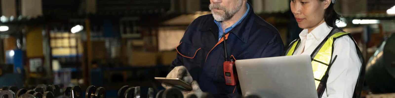 Professionals reviewing equipment utilization data.