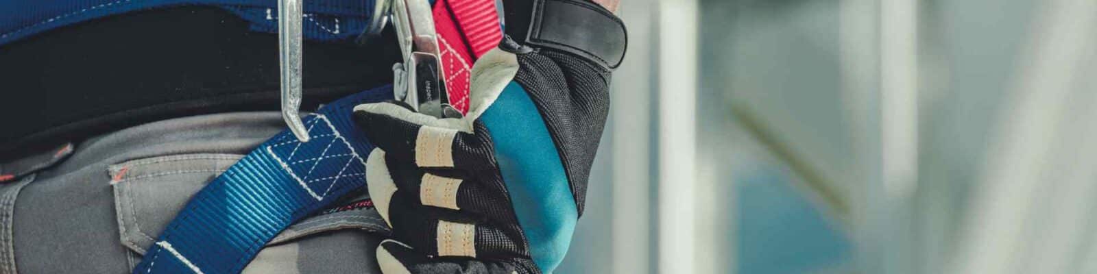 Close-up of fall protection gear on worker's belt