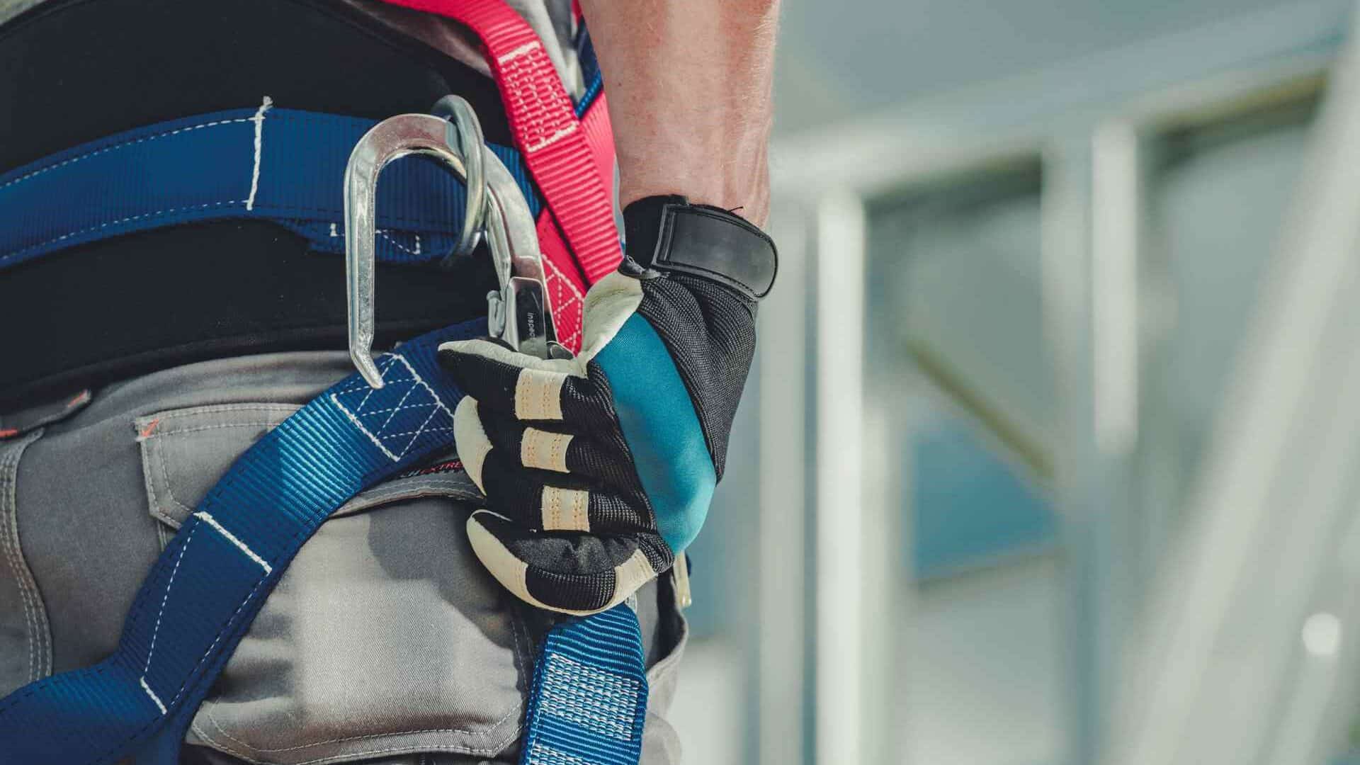 Close-up of fall protection gear on worker's belt