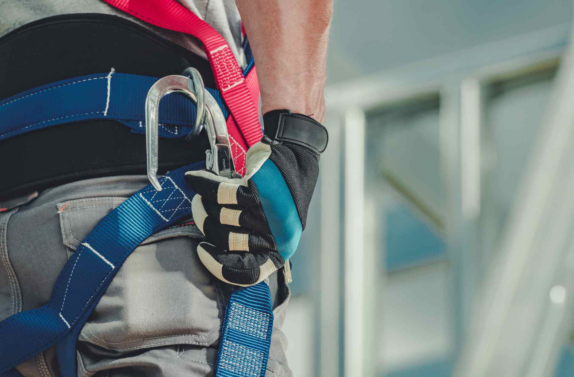 Close-up of fall protection gear on worker's belt
