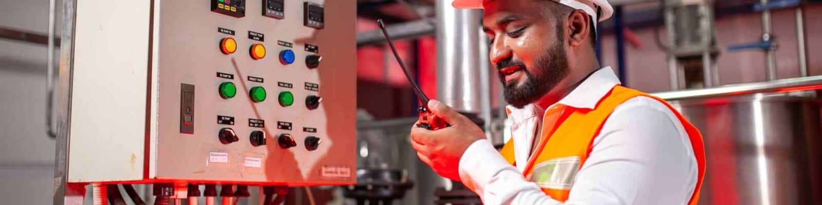 Worker implementing lockout-tagout procedure