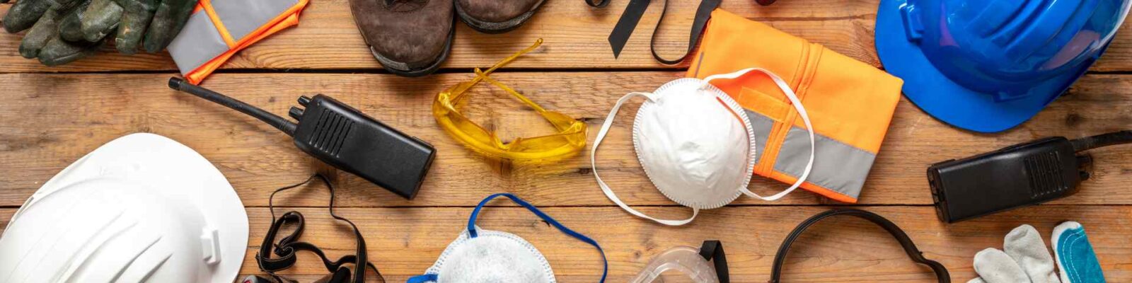 Personal protective equipment spread on wooden table