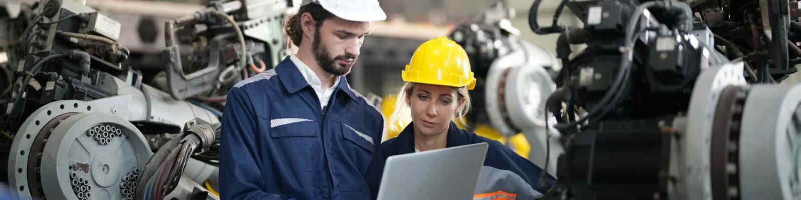 Industry professionals evaluating machinery for maintenance