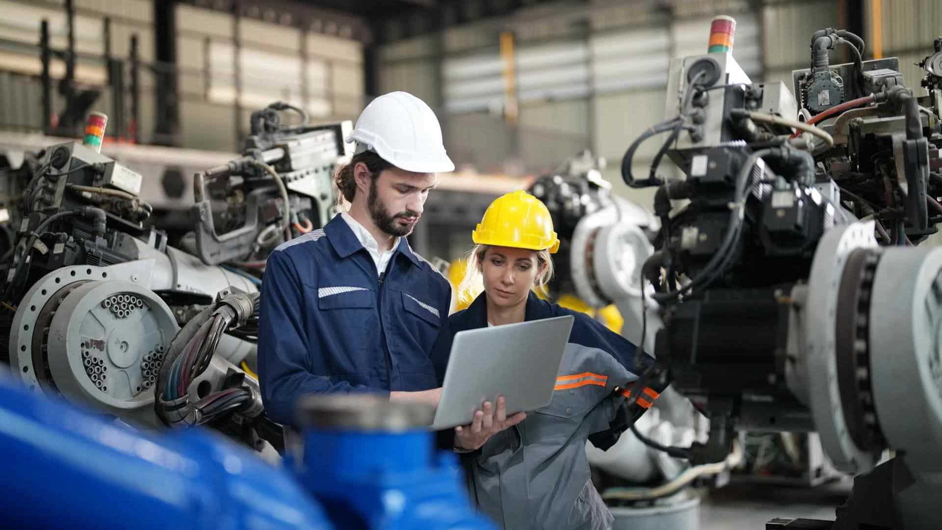 Industry professionals evaluating machinery for maintenance