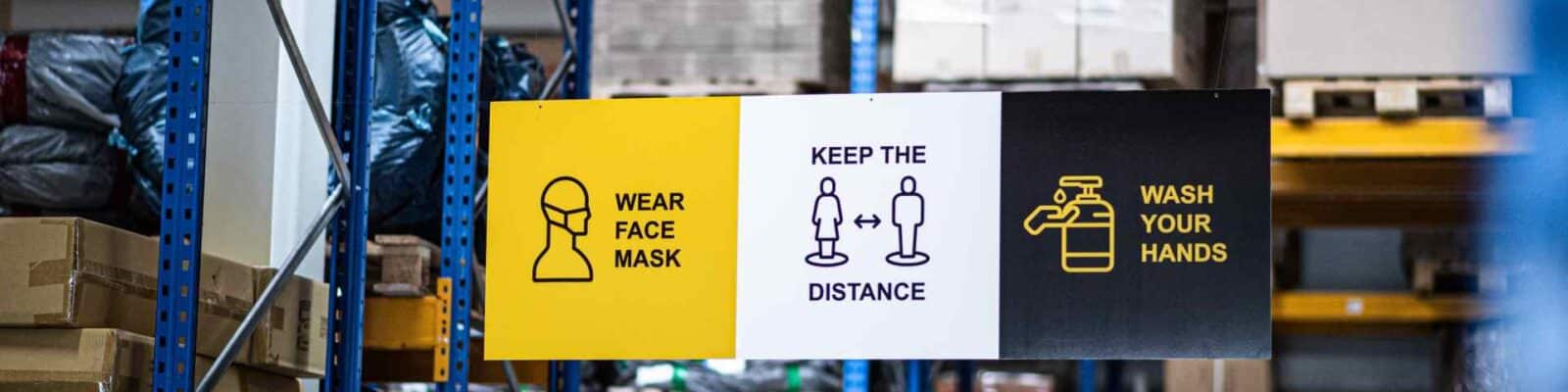 Safety signage in industrial warehouse environment.